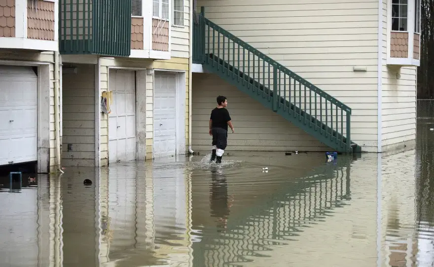 Storm water standing against townhome garages after a Puget Sound atmospheric river
